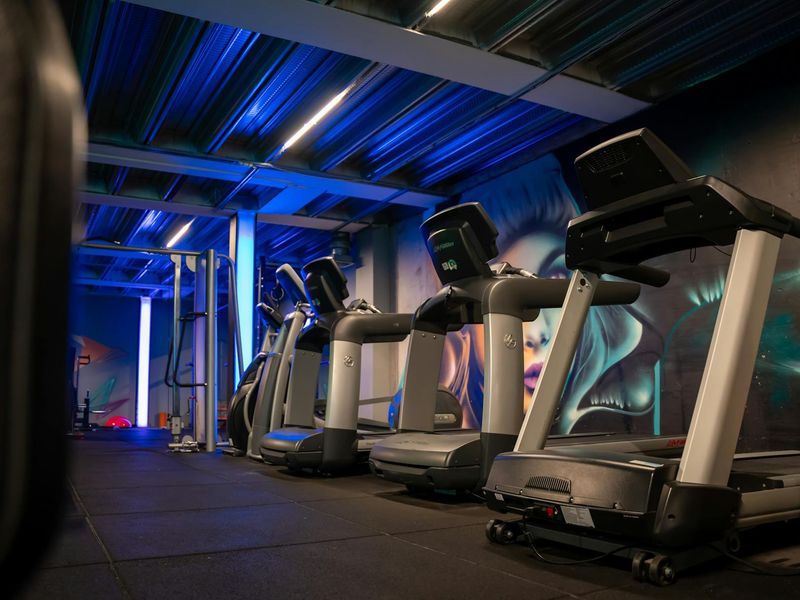 Close up of gym equipment in neon blue light